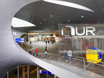 The entrance hall of Arnhem Centraal Station in the Netherlands, on July 27, 2023, features a futuristic architectural design with sweeping...