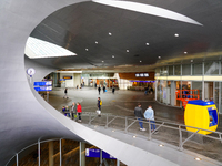 The entrance hall of Arnhem Centraal Station in the Netherlands, on July 27, 2023, features a futuristic architectural design with sweeping...