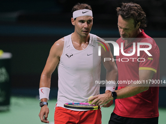 Rafael Nadal (L) of Team Spain and Carlos Moya (R) former player during Spain's training session prior to the Davis Cup match at Palacio de...