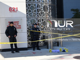 A suspect is taken into custody in front of Turkish House near the United Nations Headquarters after several stabbings leave two dead and on...