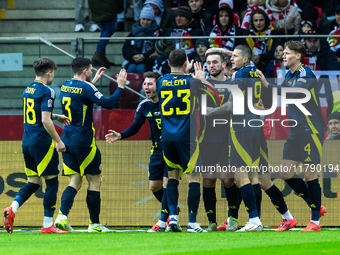 A Scottish player celebrates scoring his first goal during the UEFA Nations League 2024 Group A A1 match between Poland and Scotland at PGE...