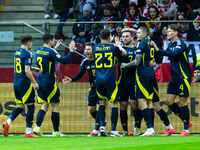 A Scottish player celebrates scoring his first goal during the UEFA Nations League 2024 Group A A1 match between Poland and Scotland at PGE...