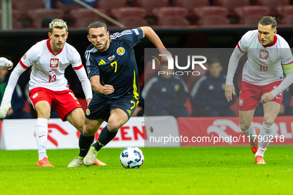 Jakub Kaminski, John McGinn are playing during the  UEFA Nations League 2024 League A Group A1 match between Poland and Scotland, at the  PG...