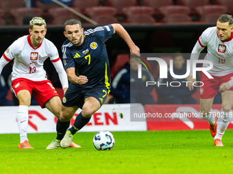 Jakub Kaminski, John McGinn are playing during the  UEFA Nations League 2024 League A Group A1 match between Poland and Scotland, at the  PG...