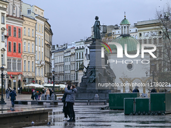 KRAKOW, POLAND - NOVEMBER 18:   
Partial view of a quiet and nearly empty Krakow's UNESCO-listed Market Square on a rainy and cold November...