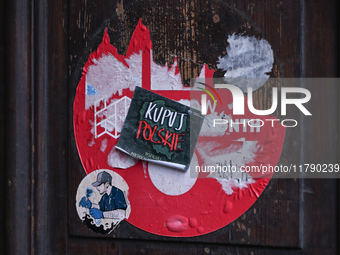 KRAKOW, POLAND - NOVEMBER 18:   
A 'Kupuj Polskie' sticker seen in Krakow's Old Town, promoting the support of Polish-made products, seen on...