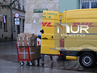 KRAKOW, POLAND - NOVEMBER 18:   
DHL delivery van in Krakow's Small Square, seen on November 17, 2024 in Krakow, Poland. (