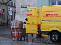 KRAKOW, POLAND - NOVEMBER 18:   
DHL delivery van in Krakow's Small Square, seen on November 17, 2024 in Krakow, Poland. (