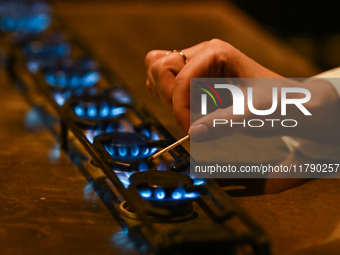 KRAKOW, POLAND - NOVEMBER 18:   
Staff member turns on natural gas burners on a stove in a Krakow cafe, seen on November 17, 2024 in Krakow,...