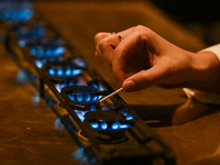 KRAKOW, POLAND - NOVEMBER 18:   
Staff member turns on natural gas burners on a stove in a Krakow cafe, seen on November 17, 2024 in Krakow,...