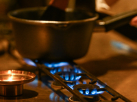 KRAKOW, POLAND - NOVEMBER 18:   
Staff member melting chocolate over natural gas burners on a stove in a Krakow cafe, showcasing the role of...