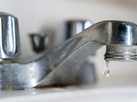 A faucet leaks in a Brooklyn, NY apartment as NYC officials declare a drought warning in New York City, USA, on November 11, 2024, after 29...