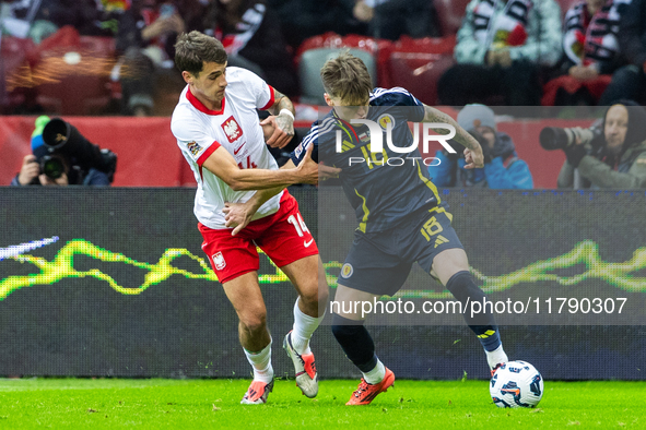 Jakub Kiwior (L) and Ben Doak are playing  during the  UEFA Nations League 2024 League A Group A1 match between Poland and Scotland, at the...