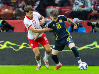 Jakub Kiwior (L) and Ben Doak are playing  during the  UEFA Nations League 2024 League A Group A1 match between Poland and Scotland, at the...