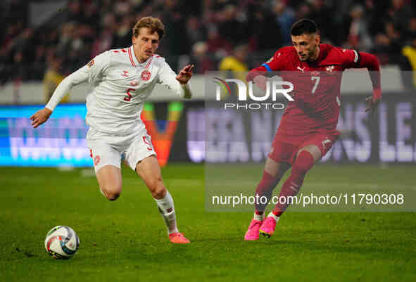 Aleksa Terzic of Serbia and Mads Roerslev of Denmark battle for the ball during the Nations League Round 6 match between Serbia qnd Denmark...