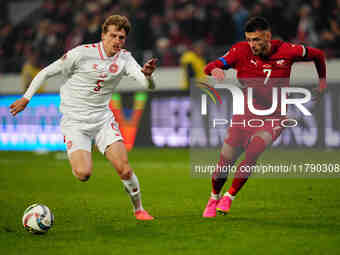 Aleksa Terzic of Serbia and Mads Roerslev of Denmark battle for the ball during the Nations League Round 6 match between Serbia qnd Denmark...