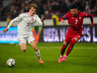 Aleksa Terzic of Serbia and Mads Roerslev of Denmark battle for the ball during the Nations League Round 6 match between Serbia qnd Denmark...