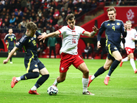 Ben Doak and Jakub Kiwior during UEFA Nations League match Poland - Scotland at National Stadium in Warsaw, Poland on November 18, 2024. (