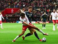 Jakub Kiwior and Scott McTominay during UEFA Nations League match Poland - Scotland at National Stadium in Warsaw, Poland on November 18, 20...