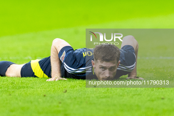 Anthony Ralston lies during the  UEFA Nations League 2024 League A Group A1 match between Poland and Scotland, at the  PGE Narodowy in Warsa...