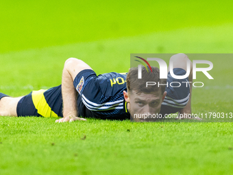 Anthony Ralston lies during the  UEFA Nations League 2024 League A Group A1 match between Poland and Scotland, at the  PGE Narodowy in Warsa...