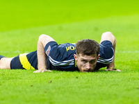 Anthony Ralston lies during the  UEFA Nations League 2024 League A Group A1 match between Poland and Scotland, at the  PGE Narodowy in Warsa...