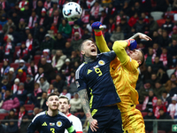 Lyndon Dykes and Lukasz Skorupski during UEFA Nations League match Poland - Scotland at National Stadium in Warsaw, Poland on November 18, 2...