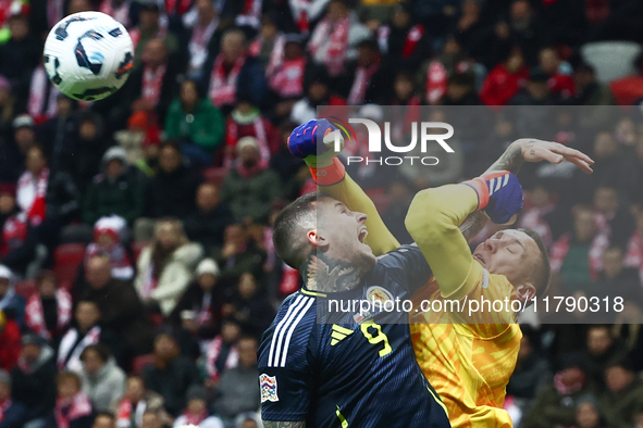 Lyndon Dykes and Lukasz Skorupski during UEFA Nations League match Poland - Scotland at National Stadium in Warsaw, Poland on November 18, 2...