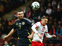 John McGinn and Sebastian Szymanski during UEFA Nations League match Poland - Scotland at National Stadium in Warsaw, Poland on November 18,...