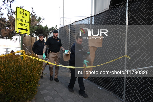 Crime scene investigators with the NYPD collect evidence and guard the scene after a 68-year-old man who is fishing is fatally stabbed multi...