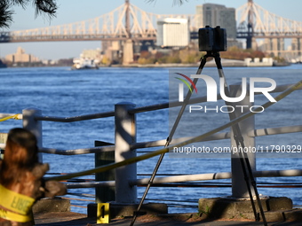 Crime scene investigators with the NYPD collect evidence and guard the scene after a 68-year-old man who is fishing is fatally stabbed multi...