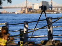 Crime scene investigators with the NYPD collect evidence and guard the scene after a 68-year-old man who is fishing is fatally stabbed multi...