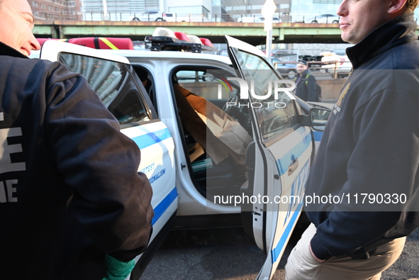 Crime scene investigators with the NYPD collect evidence and guard the scene after a 68-year-old man who is fishing is fatally stabbed multi...