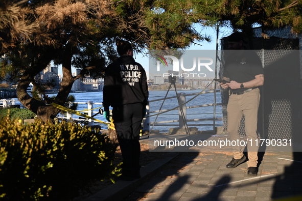 Crime scene investigators with the NYPD collect evidence and guard the scene after a 68-year-old man who is fishing is fatally stabbed multi...