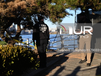 Crime scene investigators with the NYPD collect evidence and guard the scene after a 68-year-old man who is fishing is fatally stabbed multi...