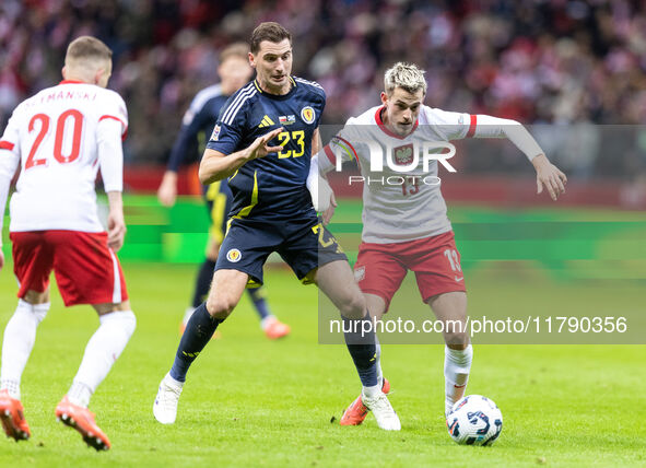 Kenny McLean , Jakub Kaminski  during UEFA Nations League match Poland vs Scotland in Warsaw Poland on 18 November 2024. 