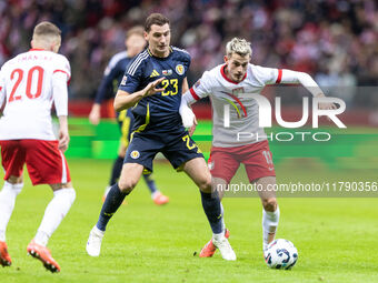 Kenny McLean , Jakub Kaminski  during UEFA Nations League match Poland vs Scotland in Warsaw Poland on 18 November 2024. (