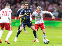 Kenny McLean , Jakub Kaminski  during UEFA Nations League match Poland vs Scotland in Warsaw Poland on 18 November 2024. (