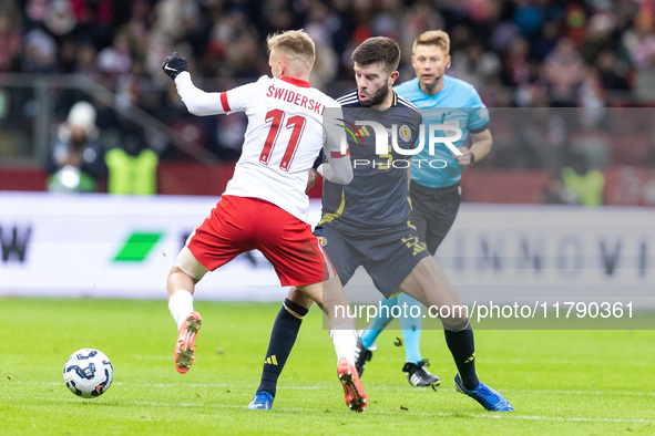 Karol Swiderski , Grant Hanley  during UEFA Nations League match Poland vs Scotland in Warsaw Poland on 18 November 2024. 