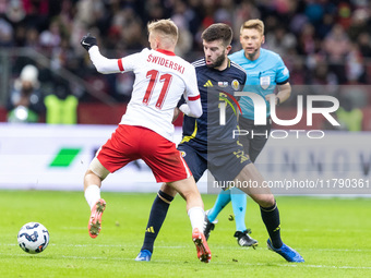 Karol Swiderski , Grant Hanley  during UEFA Nations League match Poland vs Scotland in Warsaw Poland on 18 November 2024. (