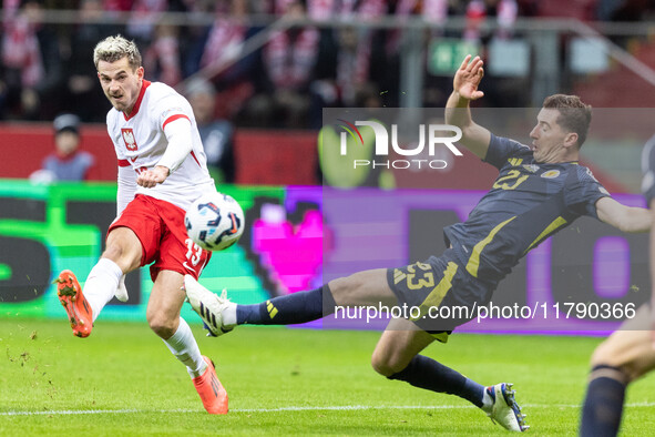 Jakub Kaminski , Kenny McLean  during UEFA Nations League match Poland vs Scotland in Warsaw Poland on 18 November 2024. 