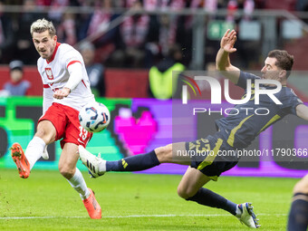 Jakub Kaminski , Kenny McLean  during UEFA Nations League match Poland vs Scotland in Warsaw Poland on 18 November 2024. (