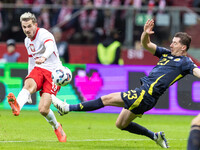 Jakub Kaminski , Kenny McLean  during UEFA Nations League match Poland vs Scotland in Warsaw Poland on 18 November 2024. (