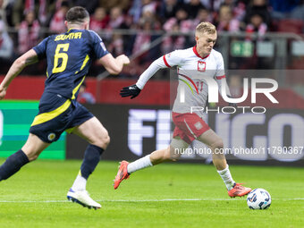 John Souttar , Karol Swiderski  during UEFA Nations League match Poland vs Scotland in Warsaw Poland on 18 November 2024. (