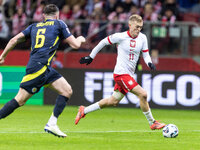 John Souttar , Karol Swiderski  during UEFA Nations League match Poland vs Scotland in Warsaw Poland on 18 November 2024. (