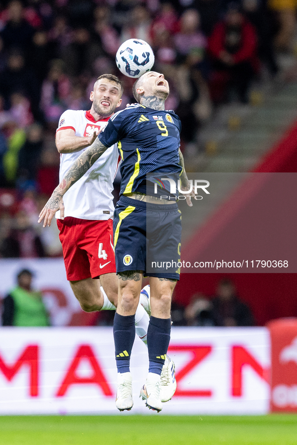 Sebastian Walukiewicz , Lyndon Dykes  during UEFA Nations League match Poland vs Scotland in Warsaw Poland on 18 November 2024. 