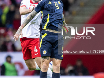 Sebastian Walukiewicz , Lyndon Dykes  during UEFA Nations League match Poland vs Scotland in Warsaw Poland on 18 November 2024. (