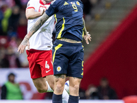 Sebastian Walukiewicz , Lyndon Dykes  during UEFA Nations League match Poland vs Scotland in Warsaw Poland on 18 November 2024. (