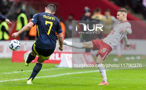 John McGinn , Sebastian Szymanski  during UEFA Nations League match Poland vs Scotland in Warsaw Poland on 18 November 2024. 