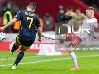 John McGinn , Sebastian Szymanski  during UEFA Nations League match Poland vs Scotland in Warsaw Poland on 18 November 2024. (